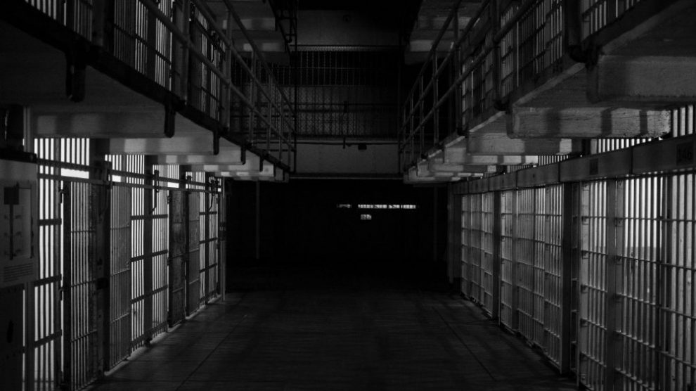 empty-hallway-of-prison-cells