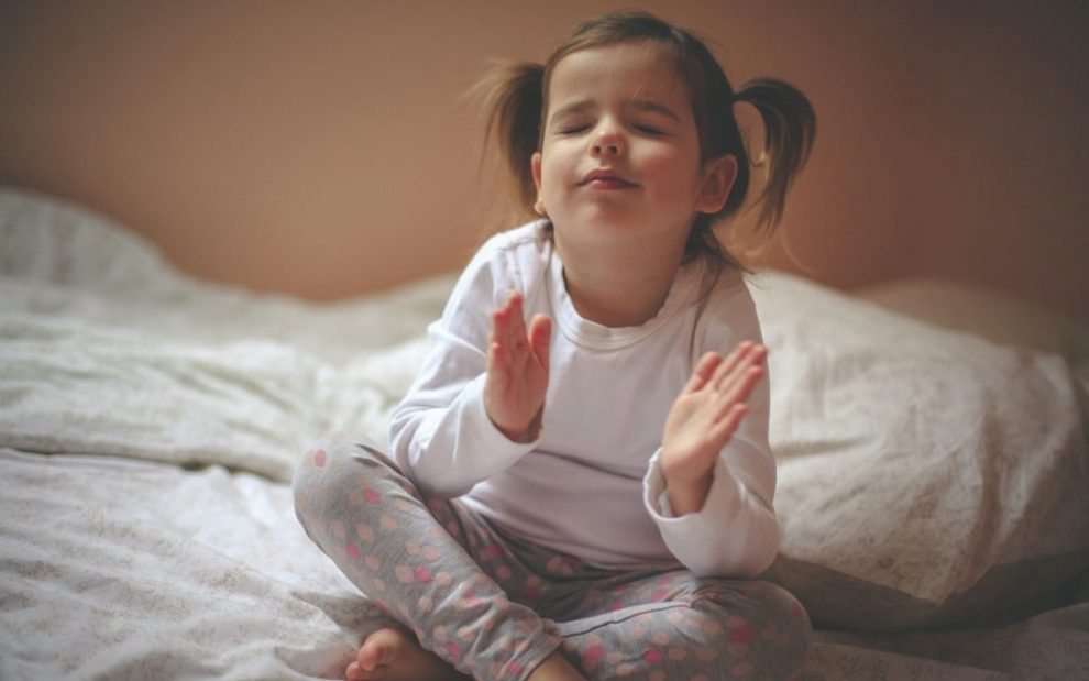 toddler-raising-hands-for-bedtime-prayer
