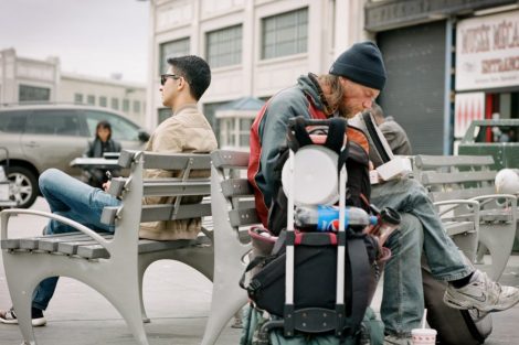 two-men-sitting-on-benches