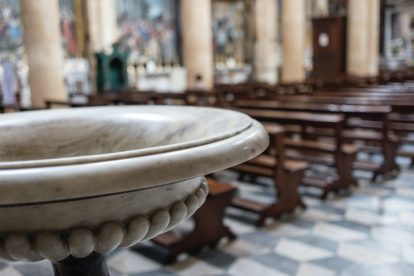 baptismal-font-in-front-of-empty-church