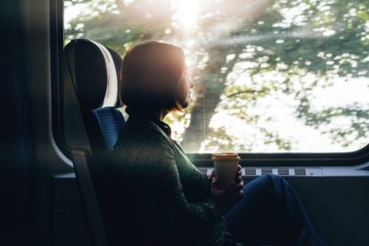 woman-looking-out-train-window