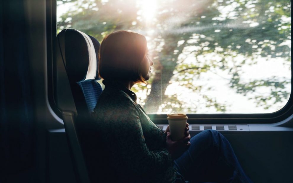 woman-looking-out-train-window