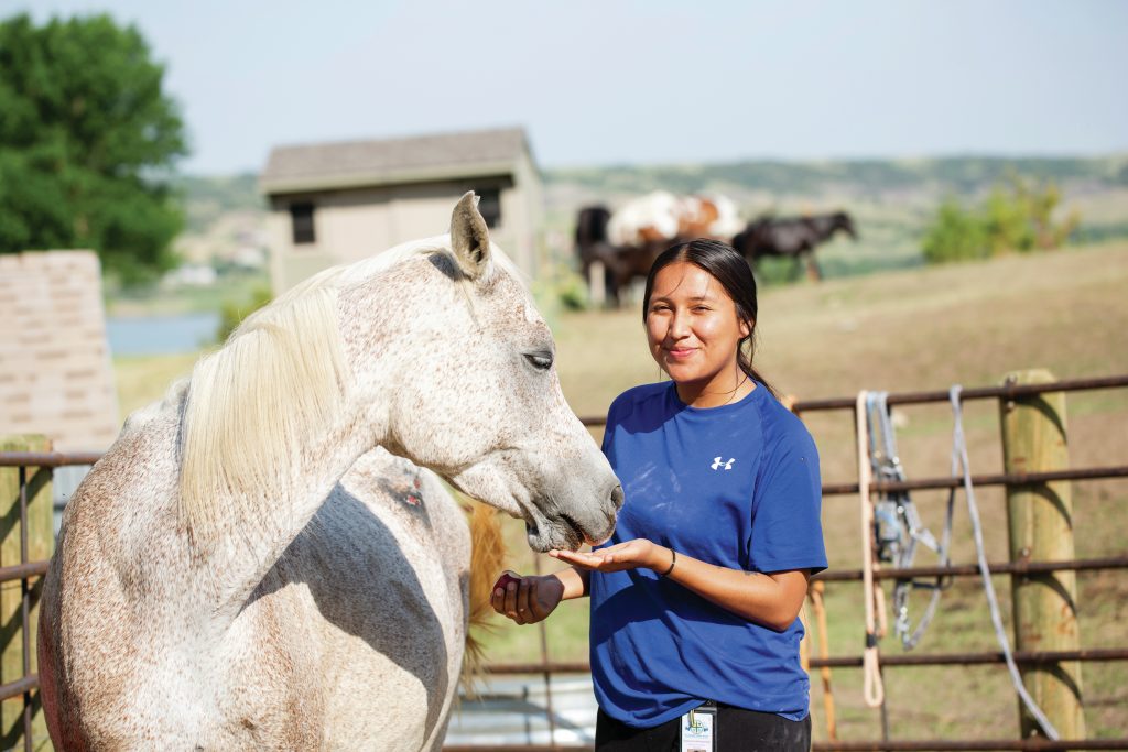 girl-with-horse-at-st-josephs-indian-school