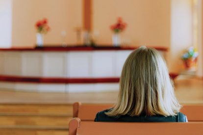 woman-sitting-alone-in-pews