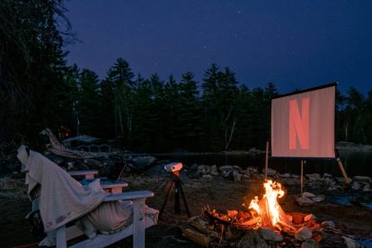 bonfire-with-projector-screen-playing-netflix
