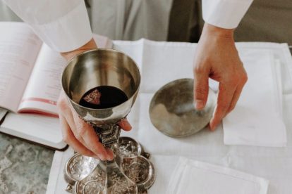 priest-preparing-eucharist