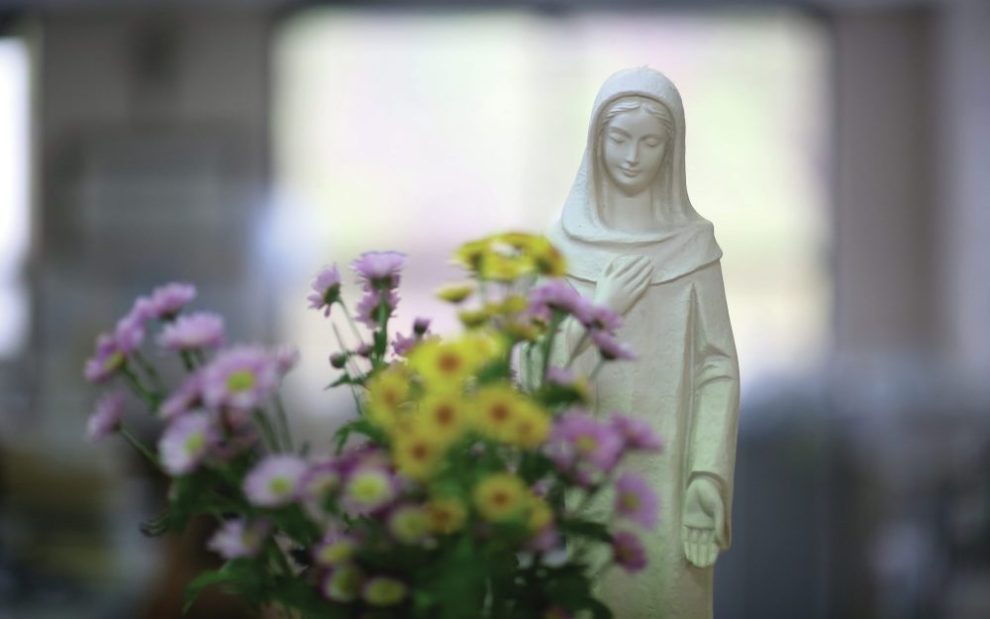 bouquet-of-flowers-with-statue-of-mary