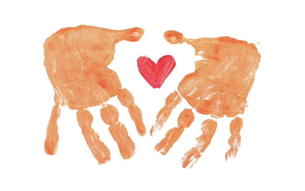 pair-of-handprints-surrounding-a-heart