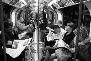 subway-passengers-reading-newspapers