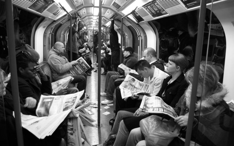 subway-passengers-reading-newspapers