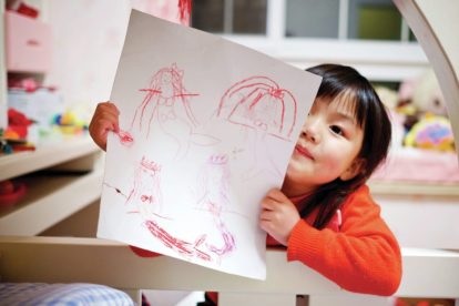 child-with-stick-figure-drawing