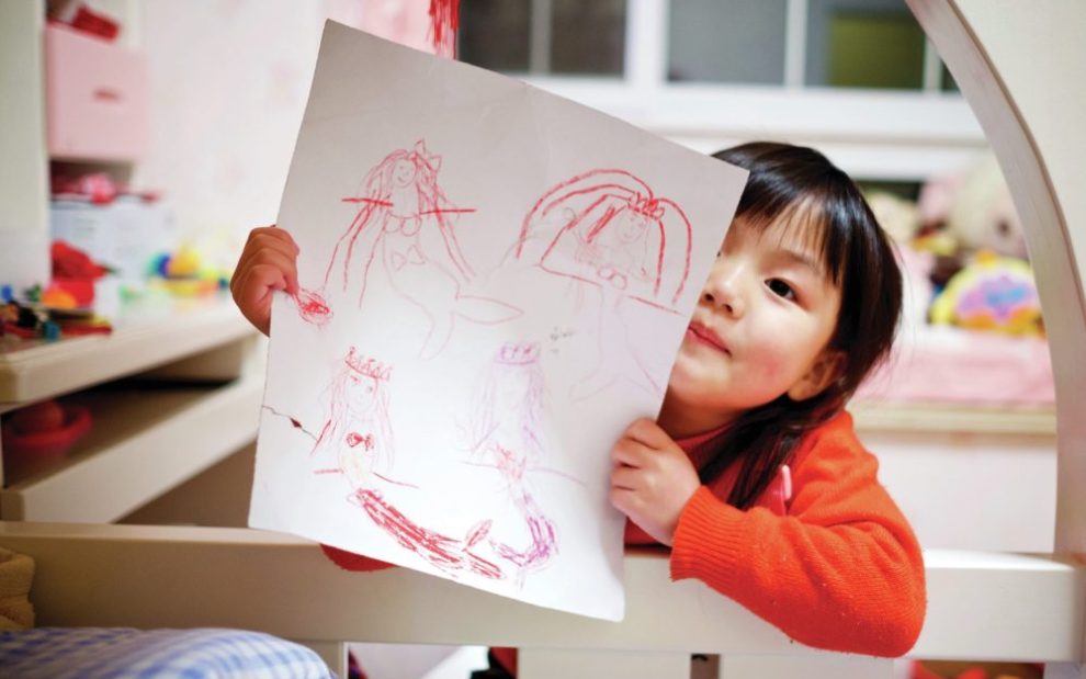 child-with-stick-figure-drawing