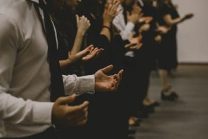 group-of-people-raising-their-hands-in-prayer