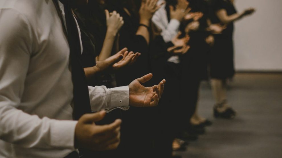 group-of-people-raising-their-hands-in-prayer