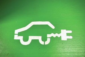 electric-vehicle-symbol-on-green-background
