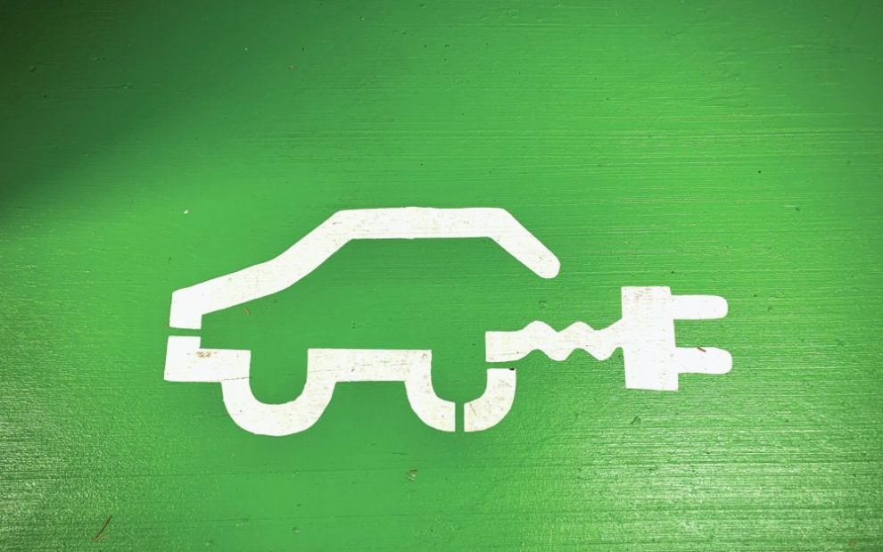 electric-vehicle-symbol-on-green-background