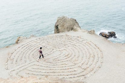 person-walking-through-stone-maze