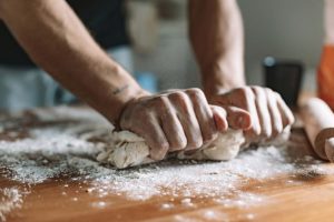 person-kneading-dough-for-bread