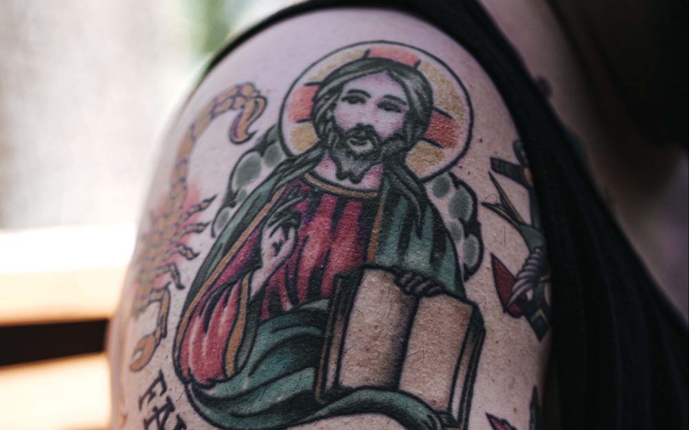 Tattoos are visible signs of lived faith . Catholic