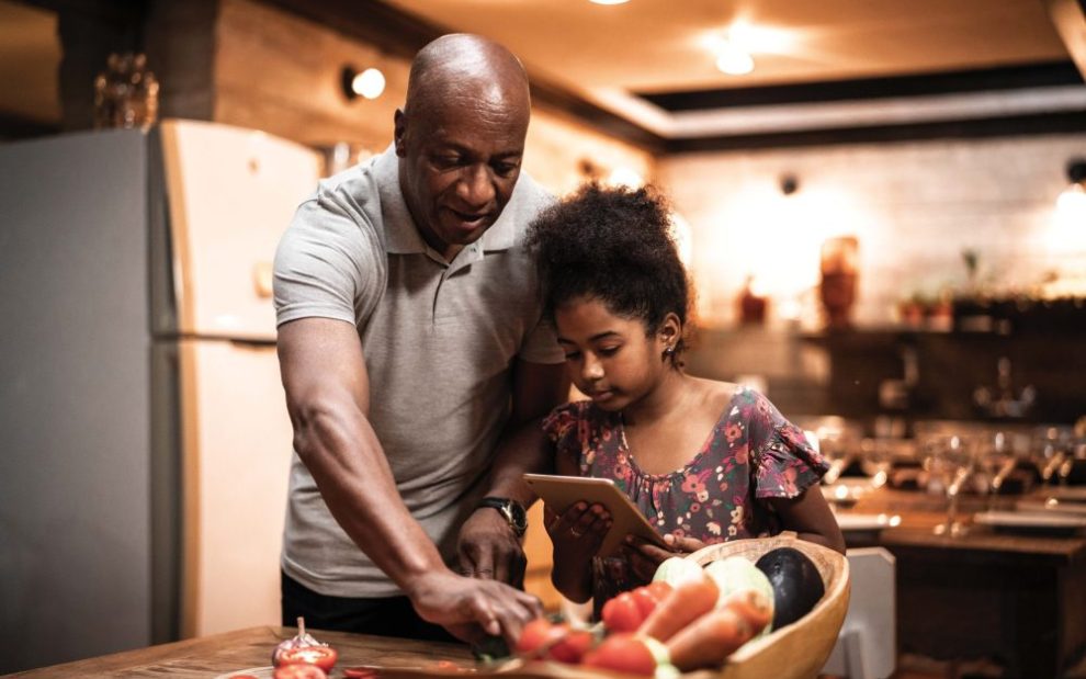 father-and-daughter-preparing-meal-together