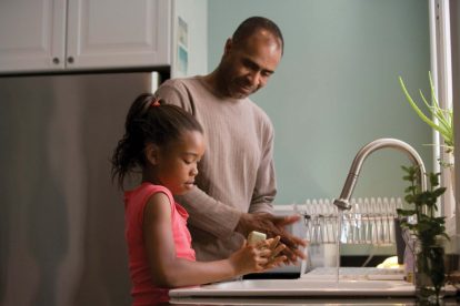 father-and-daughter-washing-dtheir-hands