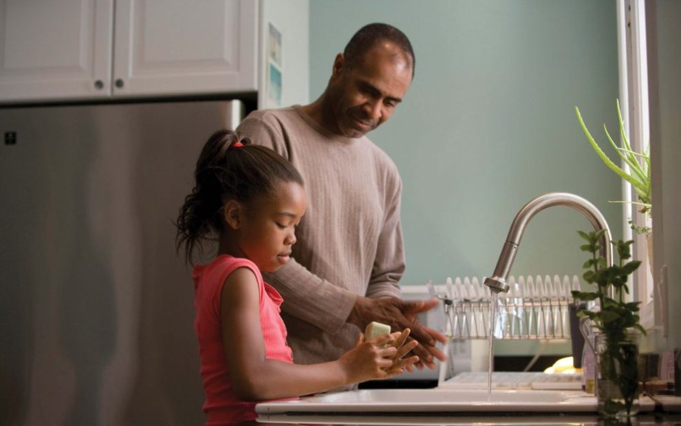 father-and-daughter-washing-dtheir-hands