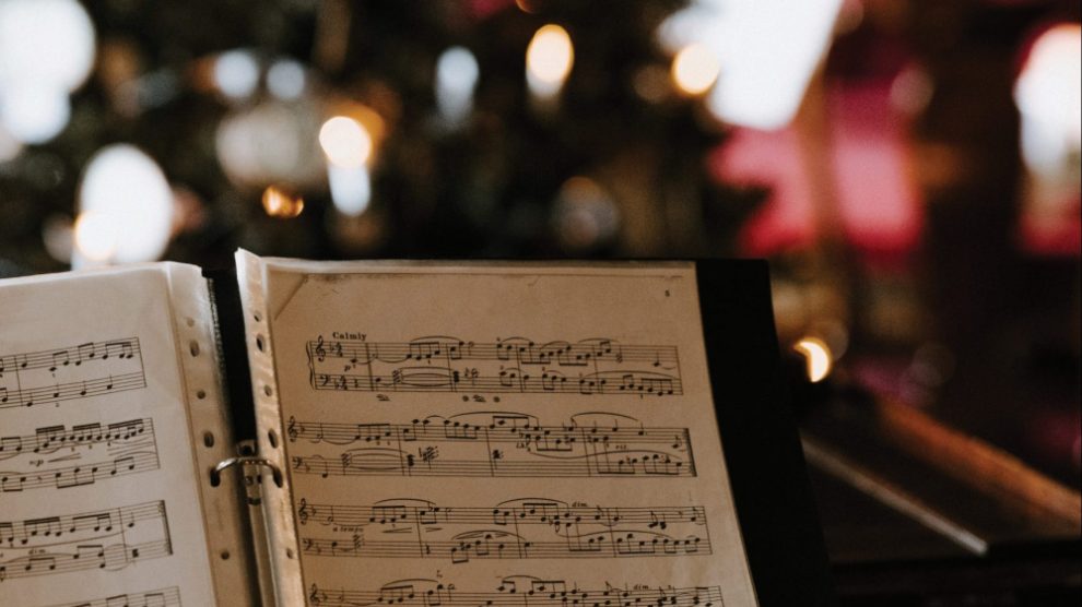sheet-music-in-front-of-a-christmas-tree