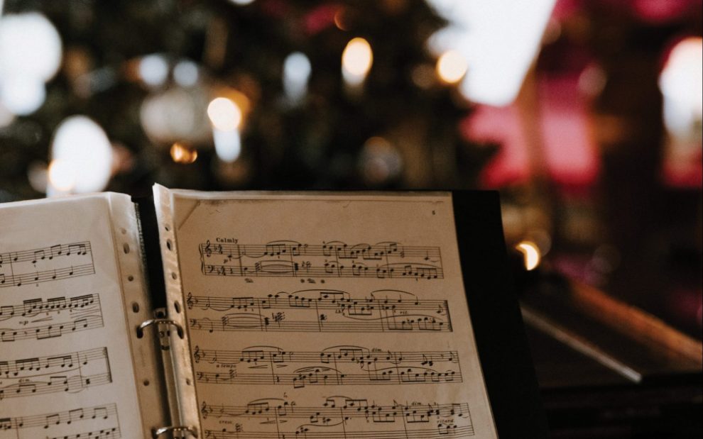 sheet-music-in-front-of-a-christmas-tree