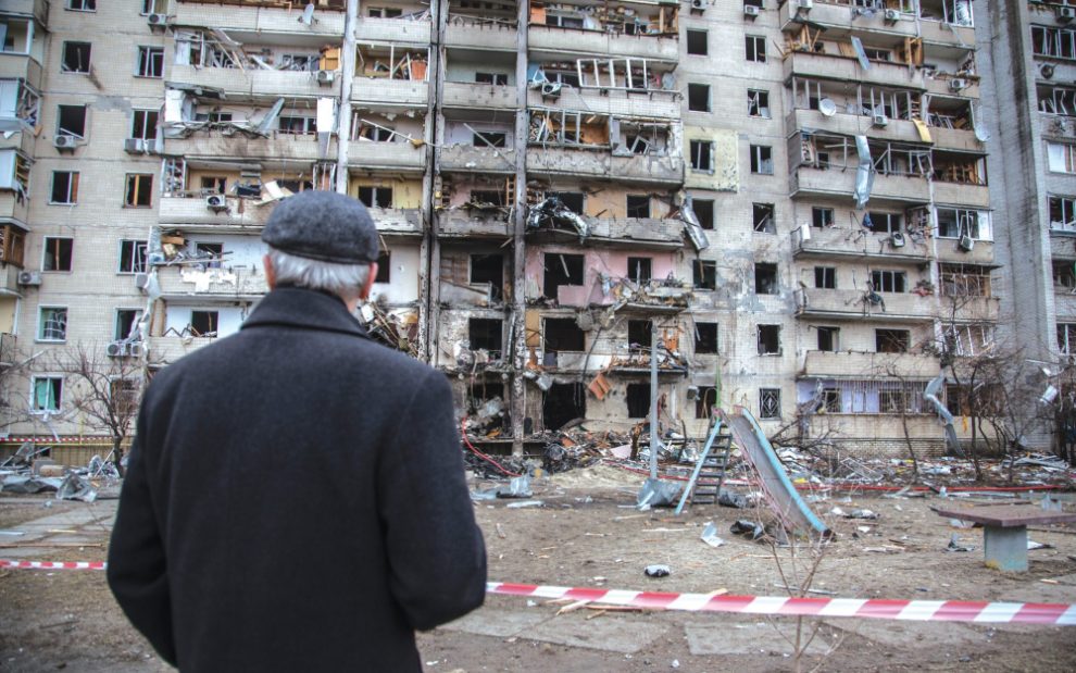 man-in-ukraine-standing-in-war-torn-city