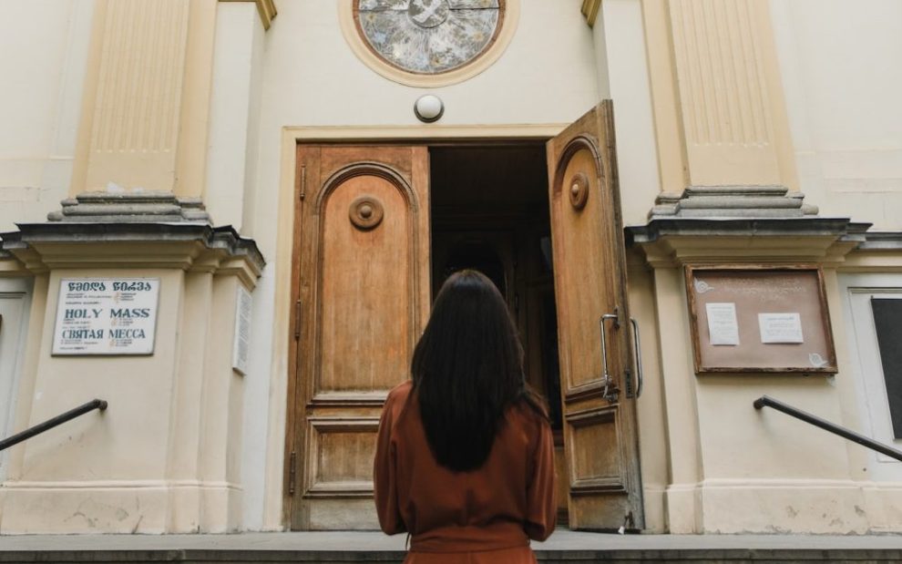 woman-standing-outside-church-entrance