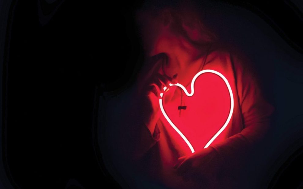 person-holding-neon-heart