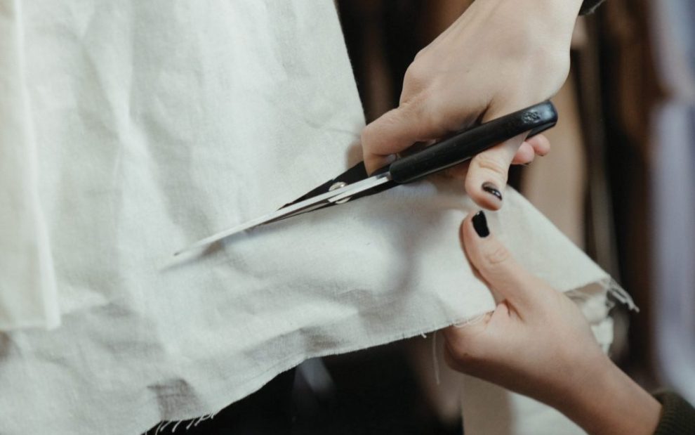 cutting-through-cloth-with-scissors