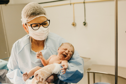 nurse-holding-newborn-baby