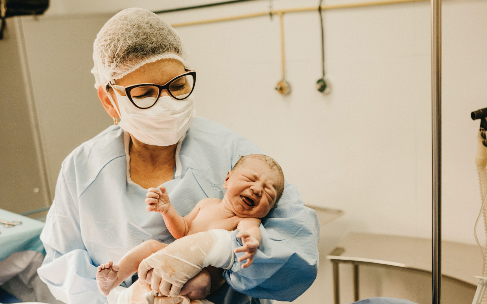 nurse-holding-newborn-baby