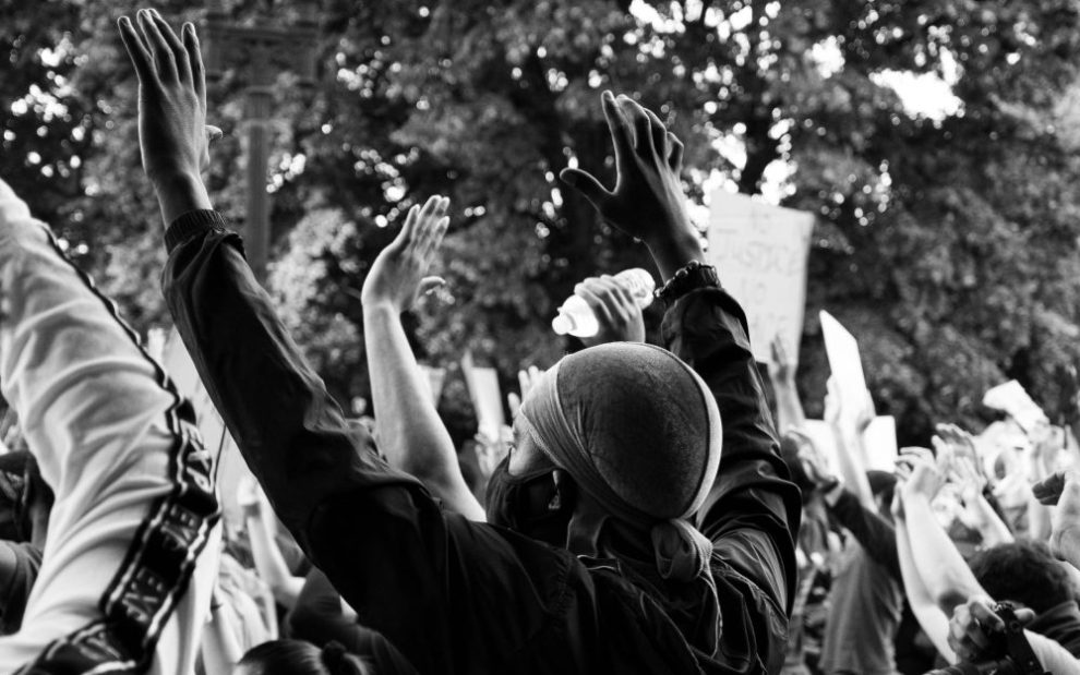 protesters-raising-their-hands