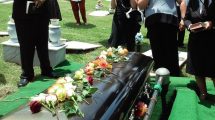 laying-flowers-on-casket-at-a-catholic-funeral