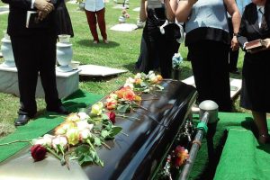 laying-flowers-on-casket-at-a-catholic-funeral