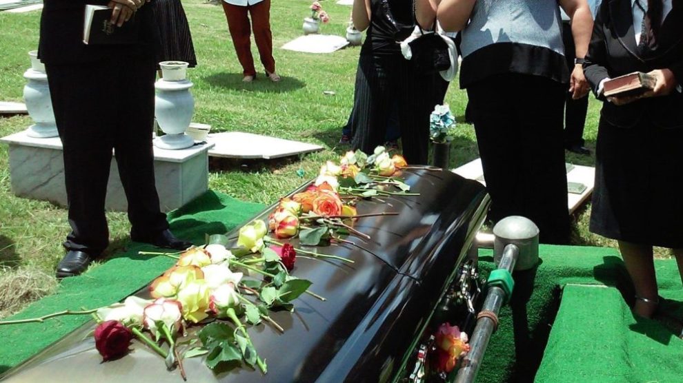 laying-flowers-on-casket-at-a-catholic-funeral