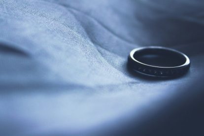 lone-wedding-ring-on-dark-background