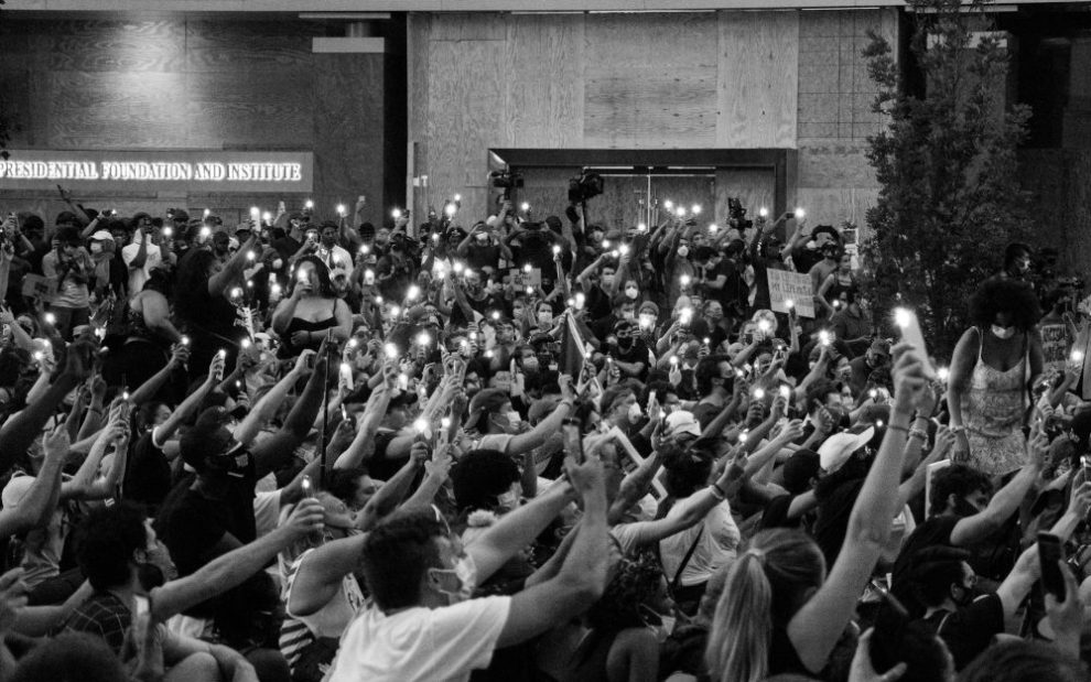 group-of-protesters-with-candles-us-catholic