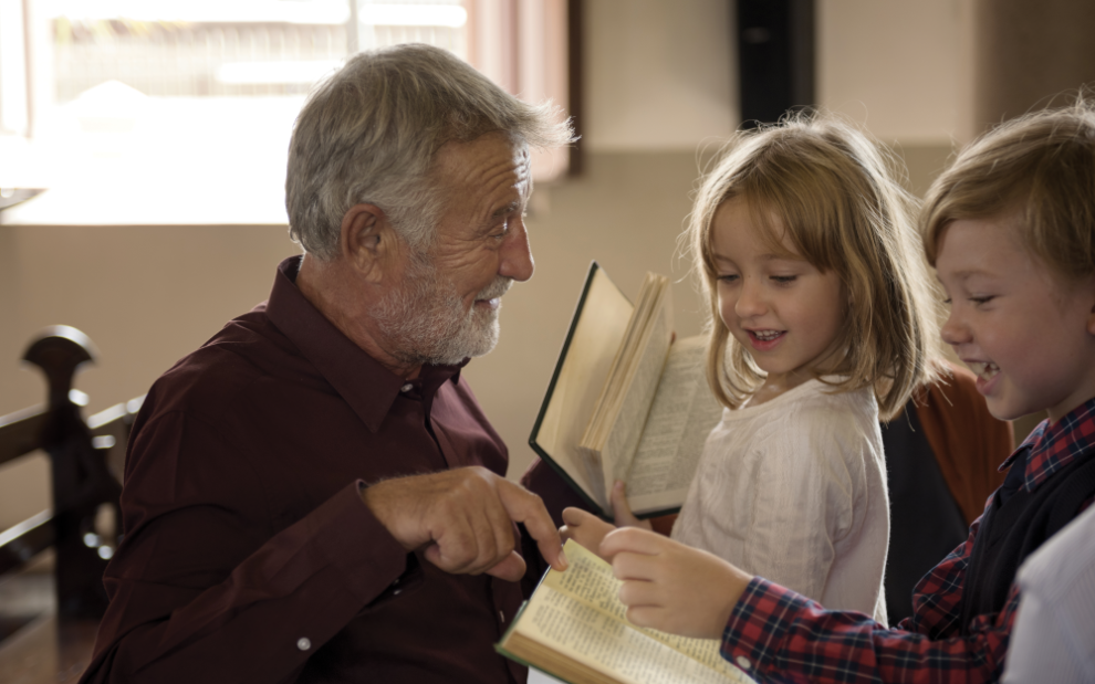 u-s-catholic-older-man-talking-with-children-in-church