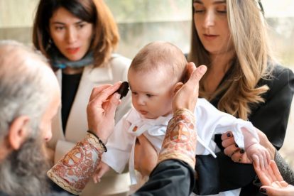 u-s-catholic-baby-at-baptism-with-godparents