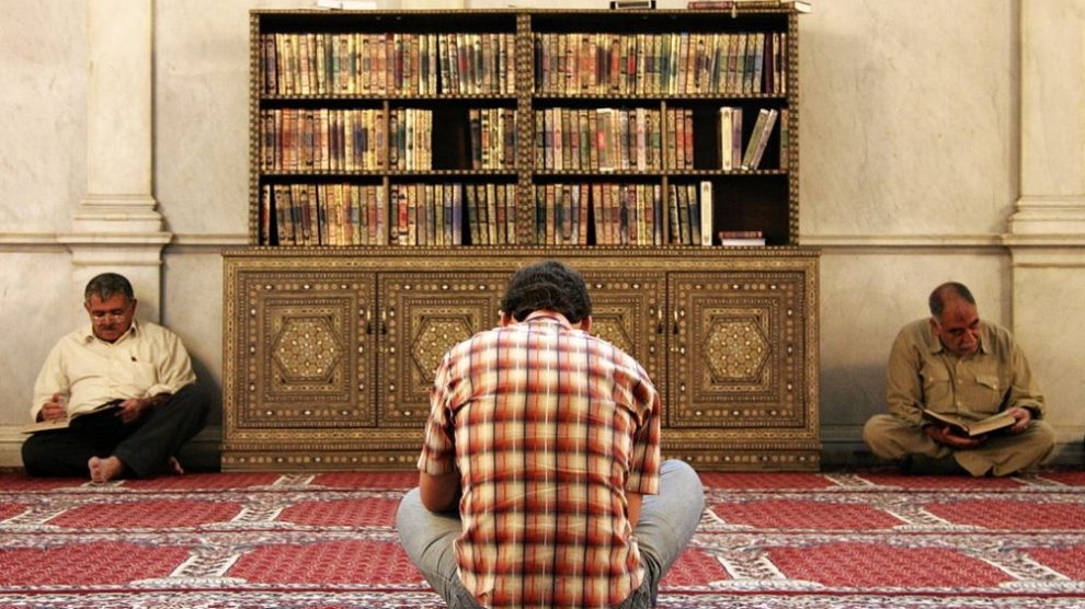 u-s-catholic-men-reading-the-quran