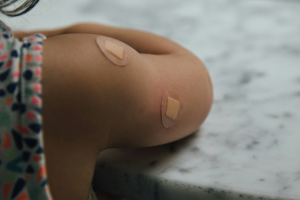 u-s-catholic-child-with-bandages-from-vaccination