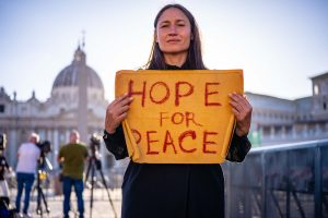 u-s-catholic-woman-with-sign-hope-for-peace