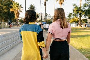 u-s-catholic-two-women-holding-hands