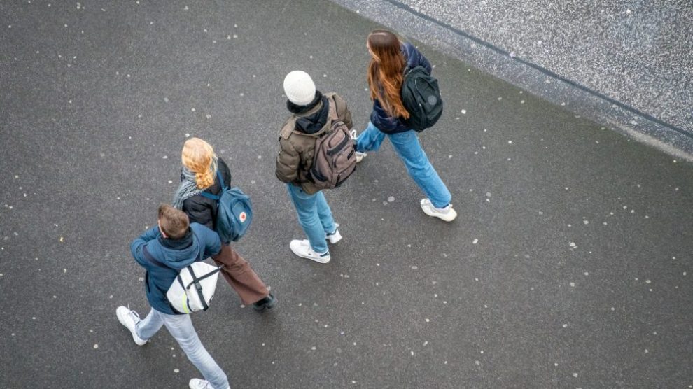 u-s-catholic-young-adults-walking-down-street