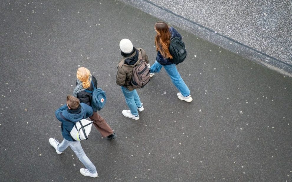 u-s-catholic-young-adults-walking-down-street