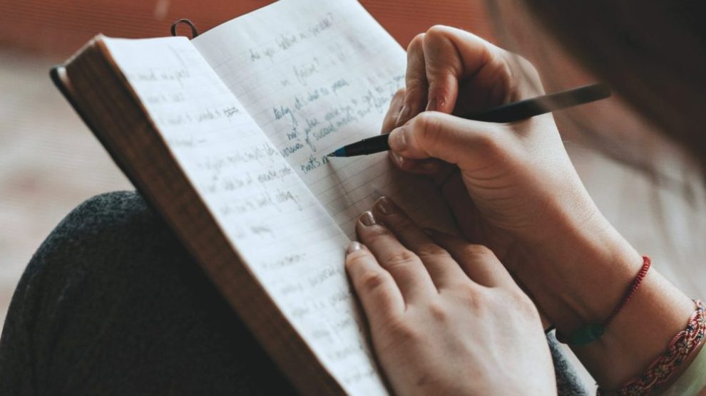 u-s-catholic-person-writing-in-journal