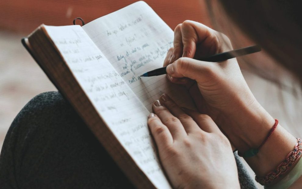 u-s-catholic-person-writing-in-journal